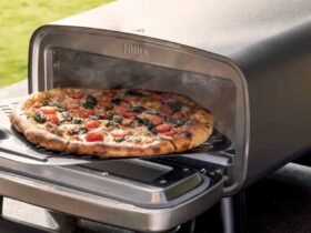 Pizza being removed from the Artisan oven