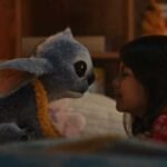 (L-R) Stitch and Maia Kealoha as Lilo in Disney’s live-action LILO & STITCH. Photo courtesy of Disney. © 2025 Disney Enterprises Inc. All Rights Reserved.