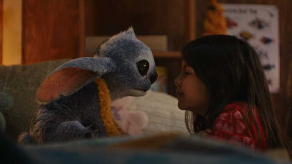 (L-R) Stitch and Maia Kealoha as Lilo in Disney’s live-action LILO & STITCH. Photo courtesy of Disney. © 2025 Disney Enterprises Inc. All Rights Reserved.