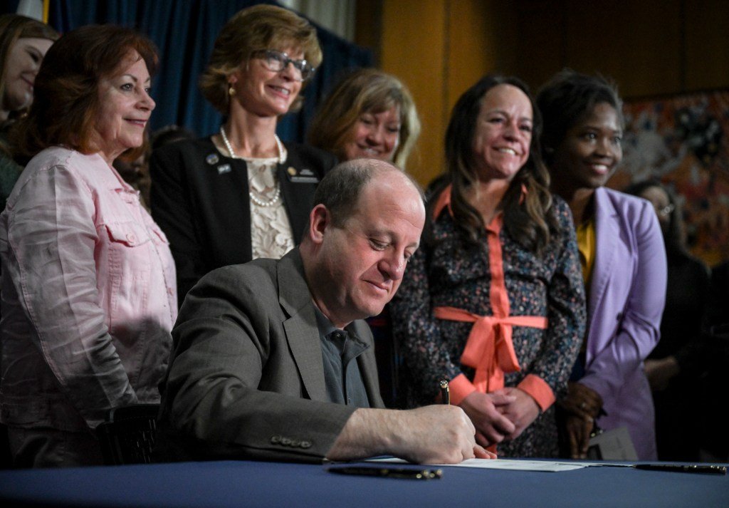Colorado Gov. Jared Polis signs public funding of abortion into law