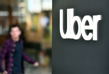 An Uber logo is seen on a sign outside the company's headquarters