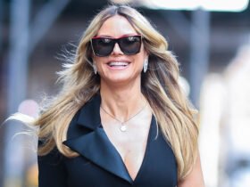 Heidi Klum suffers from embarrassing wardrobe disruption in a very high crack dress on a windy NYC day