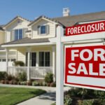 Foreclosure Home For Sale Sign in Front of Beautiful House.