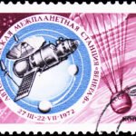 A pink postage stamp with Russian letters, the date 1972, and a blue circular inset highlighting an illustration of a spacecraft.