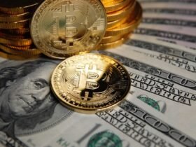 Bitcoin coins cryptocurrency on U.S. dollar banknotes background.