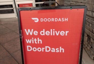 Sign reading We Deliver With Doordash, referencing the Doordash food delivery service, San Ramon, California, September 12, 2020. (Photo by Smith Collection/Gado/Getty Images)