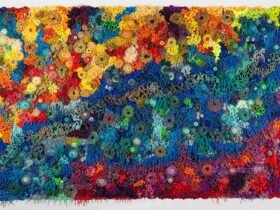 a vibrant fiber work evoking corals, molds, and other organic forms