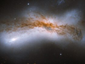 A bright cloud of cosmic material stretches across a dark void