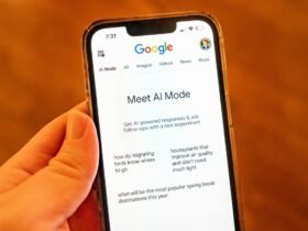 A person holding an iPhone and using Google AI Mode
