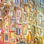 a detail of an assemblage made from tapestry elements and dozens of picture frames