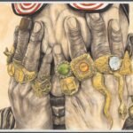 a man holds his hands over his eyes and each finger has a big gold ring with gems