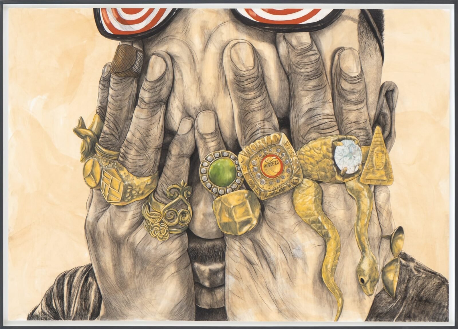 a man holds his hands over his eyes and each finger has a big gold ring with gems