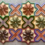 a geometric, sculptural floral embroidery on wood