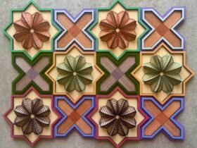 a geometric, sculptural floral embroidery on wood