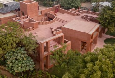 an aerial view of a contemporary brick home