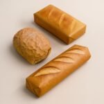 three gifts wrapped in paper with a realistic printed bread design. they resemble loaves