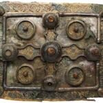 a highly decorated medieval metal book shrine
