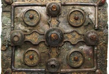 a highly decorated medieval metal book shrine